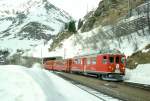 RhB GmP 4435 von St.Moritz nach Tirano am 08.02.1997 Einfahrt Alp Grm mit Triebwagen ABe 4/4II 49 - AB - BD - B.