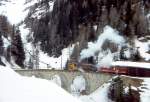 RhB DAMPFSCHNEESCHLEUDER-Extrazug fr GRAUBNDEN TOURS 4448 von Cavaglia nach Alp Grm am 01.03.1997 auf Val Pila-Viadukt mit Dampfschneeschleuder X rot d 9213 - Triebwagen ABe 4/4II 48.
