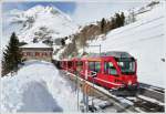 R1633 nach Tirano mit ABe 8/12 3503  Carlo Janka  mit Gterlast legt einen Halt ein in Alp Grm. (22.02.2011)