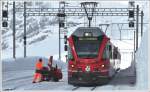 R1629 mit ABe 8/12 3510 nach Tirano legt in Ospizio Bernina 2253m einen kurzen Halt ein. (22.02.2011)