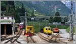 R1633 mit ABe 8/12 3501 kommt vom Berninapass herunter. 23201 und 161 stehen abgestellt in Poschiavo. (19.06.2013)