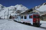 ABe 4/4 III und 51 mit Sonderbemalung für Unseco Weltkulturerbe  ALBULA,BERNINA  verlässt Alp Grüm Richtung Tirano am 01.03.2013