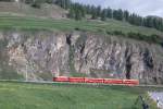 RhB Regionalzug 234 von Scuol nach St.Moritz am 07.06.1992 zwischjen Samedan und Celerina mit E-Lok Ge 4/4I 604 - D - B - AB - AB. Hinweis: gescanntes Dia
