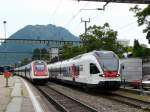 SBB - ICN (Schnellzug)wird vom Triebzug RABe 524 017-1 (Dienstfahrt)im Bahnhof von Lugano berholt am 13.05.2009
