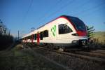 RABe 521 028-1. Es gab doch noch ein Ende dieser beeindruckenden Vorbeifahrt der vielen zusammengekoppelten  Flirt  Triebzge bei Zeihen im Kanton Aargau. 14.12.2006