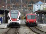 SBB / CJ - Regio nach Olten mit dem RAbe 523 039 und Regio nach Bonfol im Bahnhof von Porrentuy am 30.10.2010