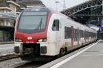 SBB Flirt TSI RABe 523 113 am 12.11.22 bei der Ausfahrt in Lausanne.