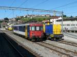 SBB - Schnappschuss Triebwagen RBe 4/4  540 043-7 neben unbekannter Baulok im Bahnhof Romont am 23.06.2012 .. Bild wurde aus einem Fahrendem Extrazug hinaus gemacht 