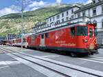 MGB Regio nach Andermatt mit der Deh 4/4 I 51  Disentis  am 23.6.21 bei der Überquerung des Bahnhofplatzes Brig.