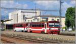 812 027-5 und 012 006-3 nach Brezno verlassen als Os7707 den Bahnhof Banská Bystrica. (07.06.2014)