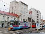 7935 ist als Werbetrger eines Reisebros zur Endstation Rača-Komisrky der Linie 5 in Bratislava unterwegs; 130828