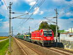 Feldkirchen. Die 541 103 rast hier am 30.08.2024 mit einem Autozug durch Flughafen Graz-Feldkirchen Richtung Adria.