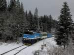 Die 754 015 mit einem Os nach Bayerisch Eisenstein am 27.12.2014 unterwegs bei Böhmisch Eisenstein.