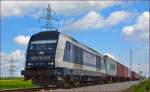 METRANS 761 007 zieht Containerzug durch Cirkovce Richtung Koper Hafen. /22.4.2014