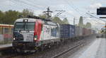 EP Cargo a.s., Ostrava [CZ]  193 844  [NVR-Nummer: 91 80 6193 844-8 D-LTEU], aktueller Mieter? mit Containerzug bei Starkregen und seitlichem Sonnenschein (Aprilwetter) bei der Durchfahrt Bf.