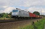 Metrans 386 018-6 mit Containerzug in Fahrtrichtung Nienburg(Weser).