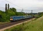 480 024 mit einem Regionalzug am 09.06.2012 bei Biatorbgy.