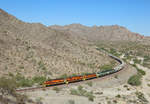 After interchanging with BNSF at Castle Hot Springs, 3999, 3997, 3998, 4001 & 4002 pass Hope as they return to Parker, 29 October 2019. 

This train was running later than expected due to a BNSF train using the Arizona & California line and also a track inspection taking place....