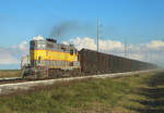 308 powers away from Moore Haven as it hauls empty sugarcane wagons back to the fields for loading, 22 Nov 2017