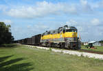 312 passes South Bay whilst hauling BT1, empty sugarcane cars from Clewiston to Bryant, 14 Feb 2020.