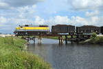 506 passes Lake Harbor whilst hauling a train of sugarcane from Bryant to Clewiston, 23 Nov 2017