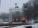 BNSF 5370 and CP Rail 5424 pull a mixed freight around the curve from across the Mississippi River in Burlington, Iowa on a cold day in December 2005.