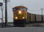 BNSF 9906 pulls an empty coal train through the Burlington, Iowa yard and is now about to cross Main Street.