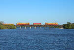 813 & 802 cross Spruce Creek whilst hauling train 105 to Miami, 2 March 2022