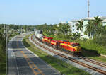 819 & 823 approach Stuart hauling train 105 to Miami, 16 June 2022