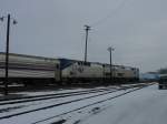 Amtrak 185 & 158 wait patiently on a snowy December day for eastbound passengers to load at Burlington, Iowa.