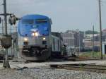 Amtrak 177 pulls train out of Burlington, Iowa yard through South Street intersection on its afternoon journey to Chicago on 30 July 2003.